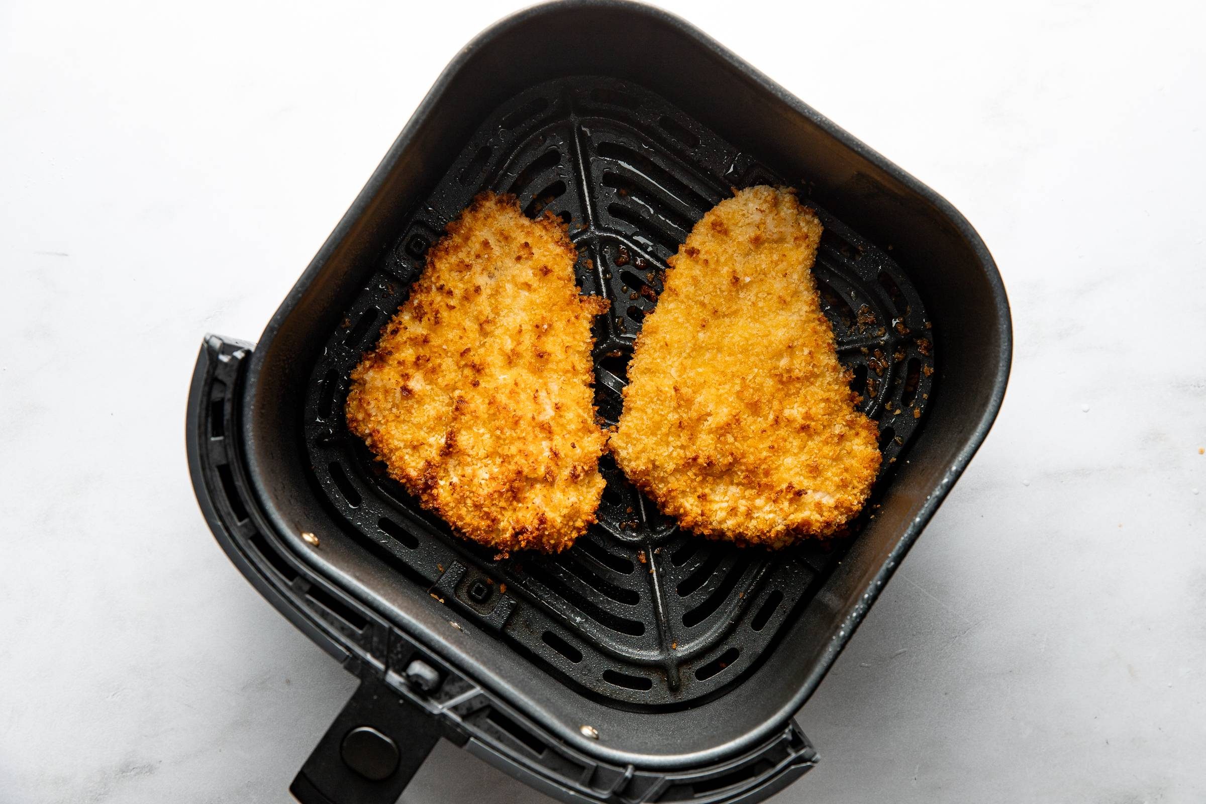 Crispy chicken in an air fryer.