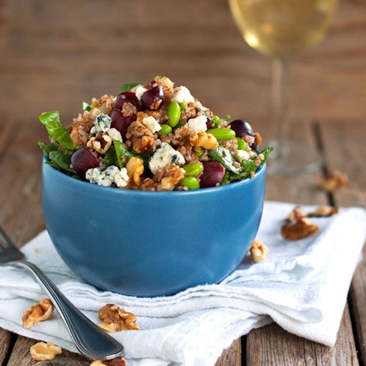 Honey walnut power salad in a blue bowl.